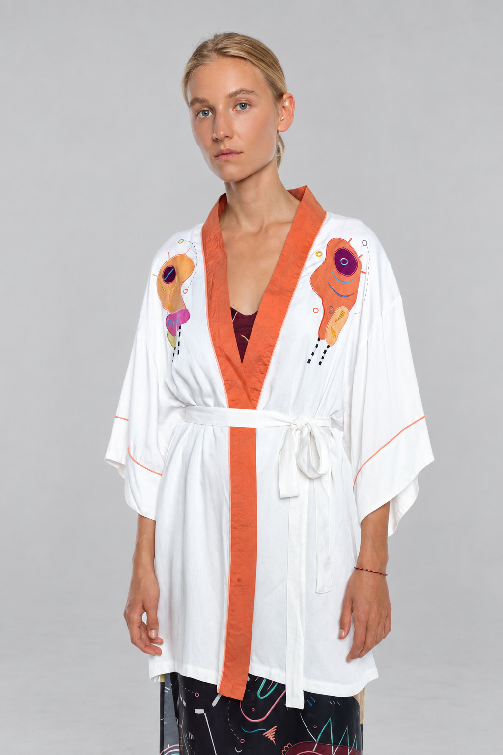 Antidote kimono, front view on a model against neutral grey