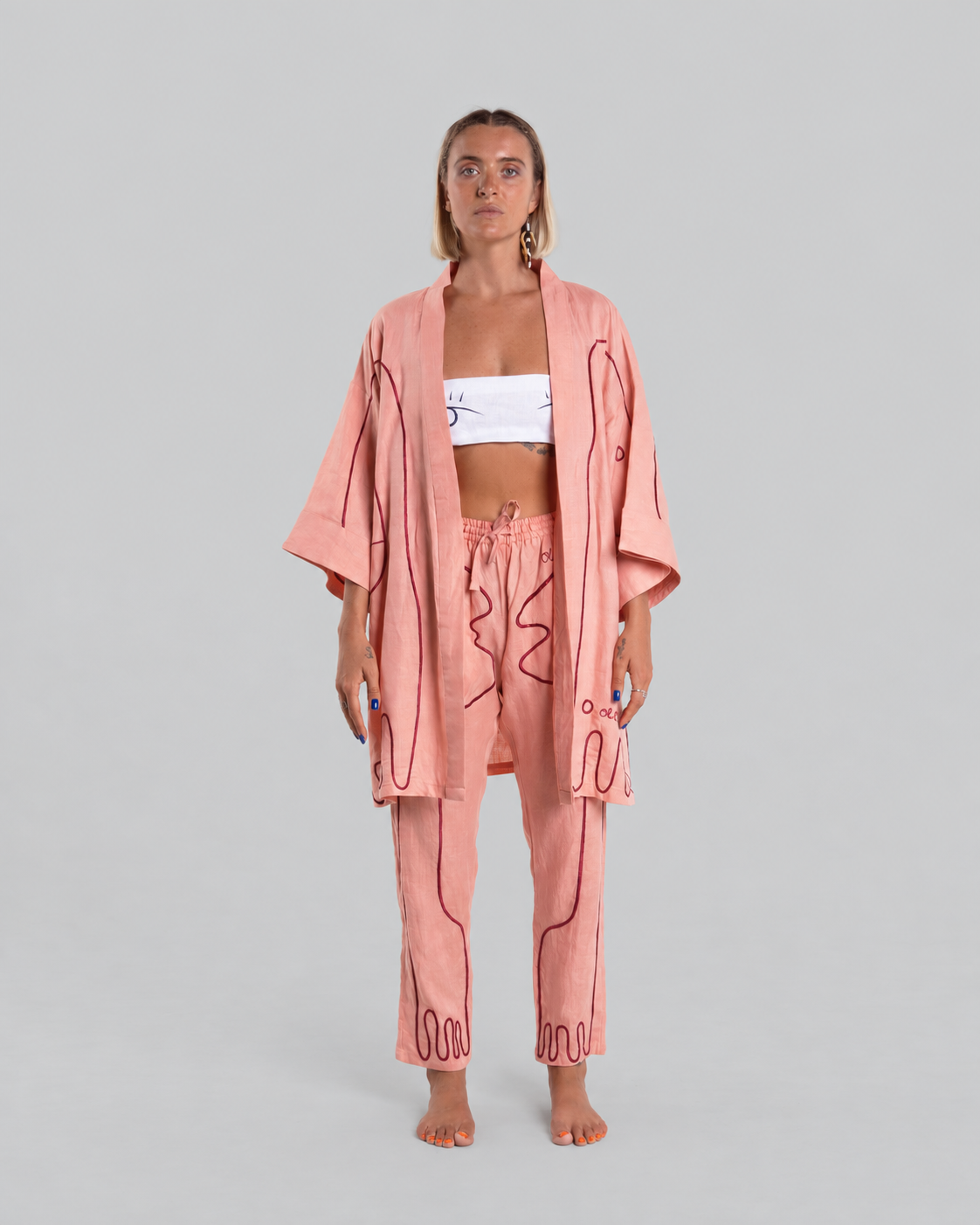 Peachy Punk Giraffe kimono set, front view against a neutral grey background