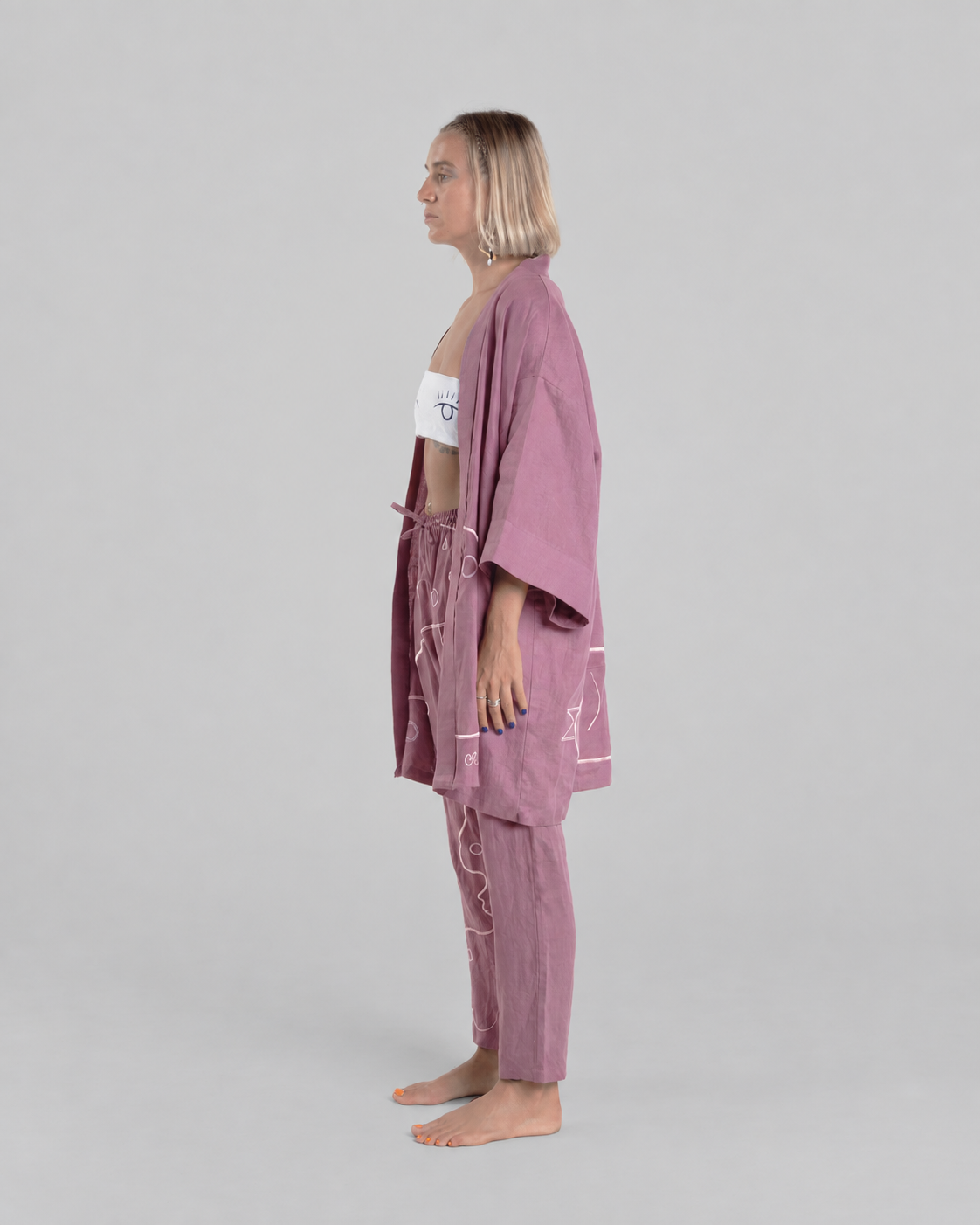 Purple Vortex kimono set, side view on a model against a neutral grey background