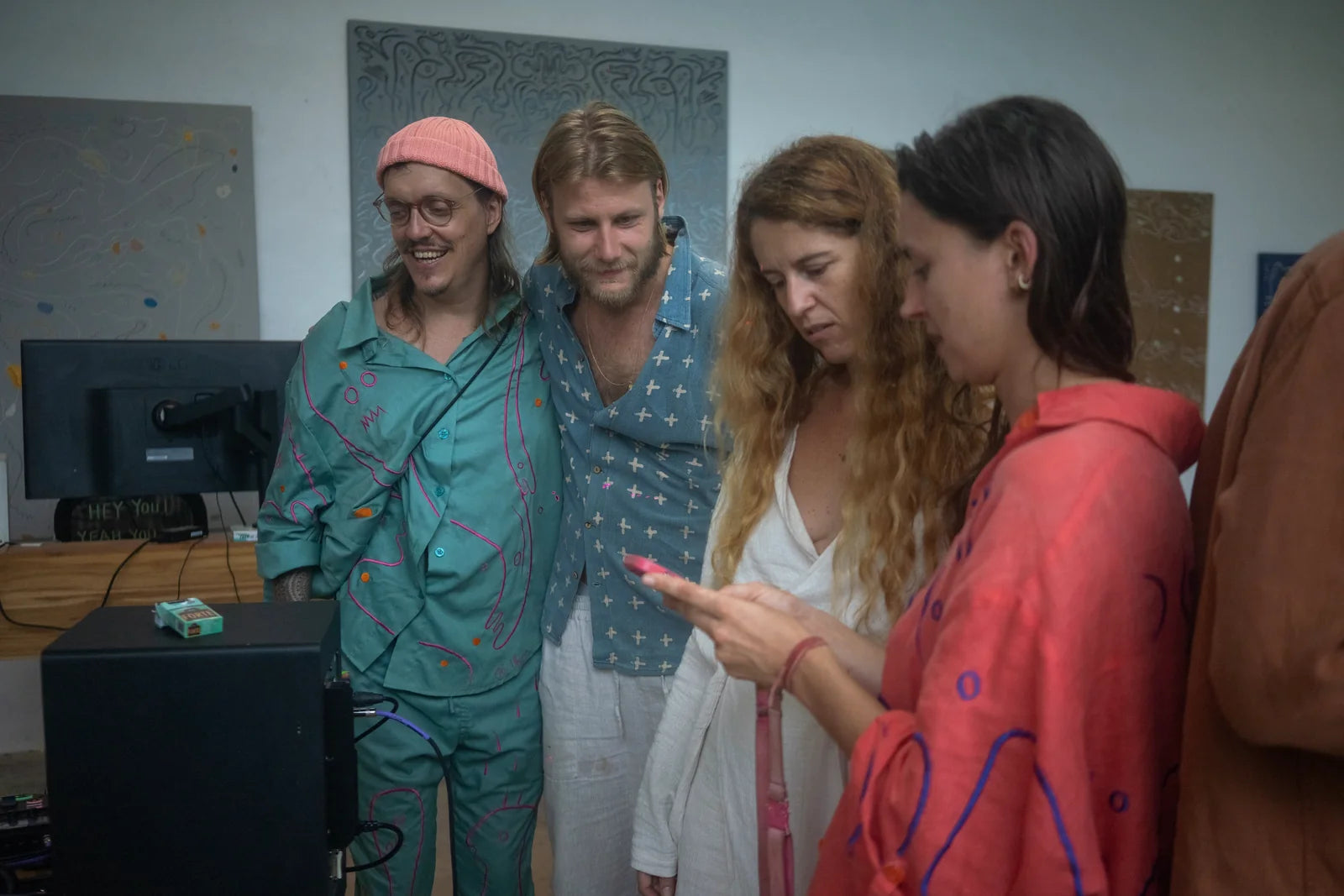 Guests looking at drawings and garments in the AIR studio