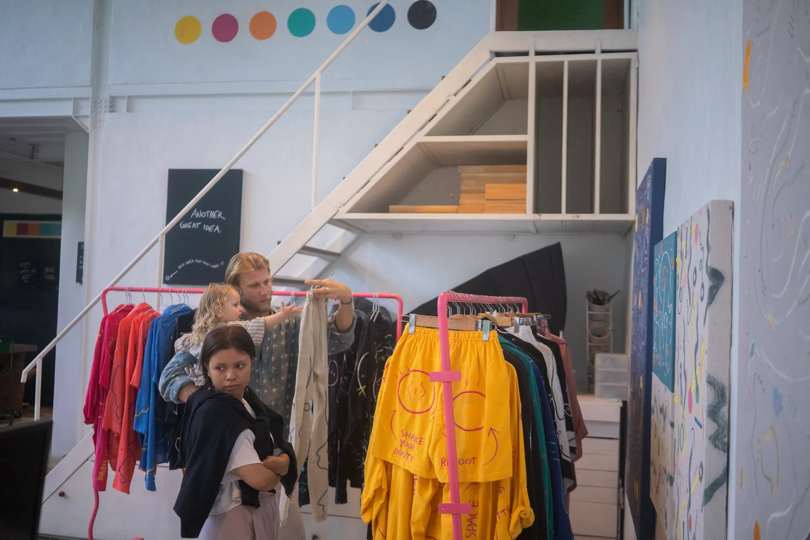 Visitors moving through the studio between finished works