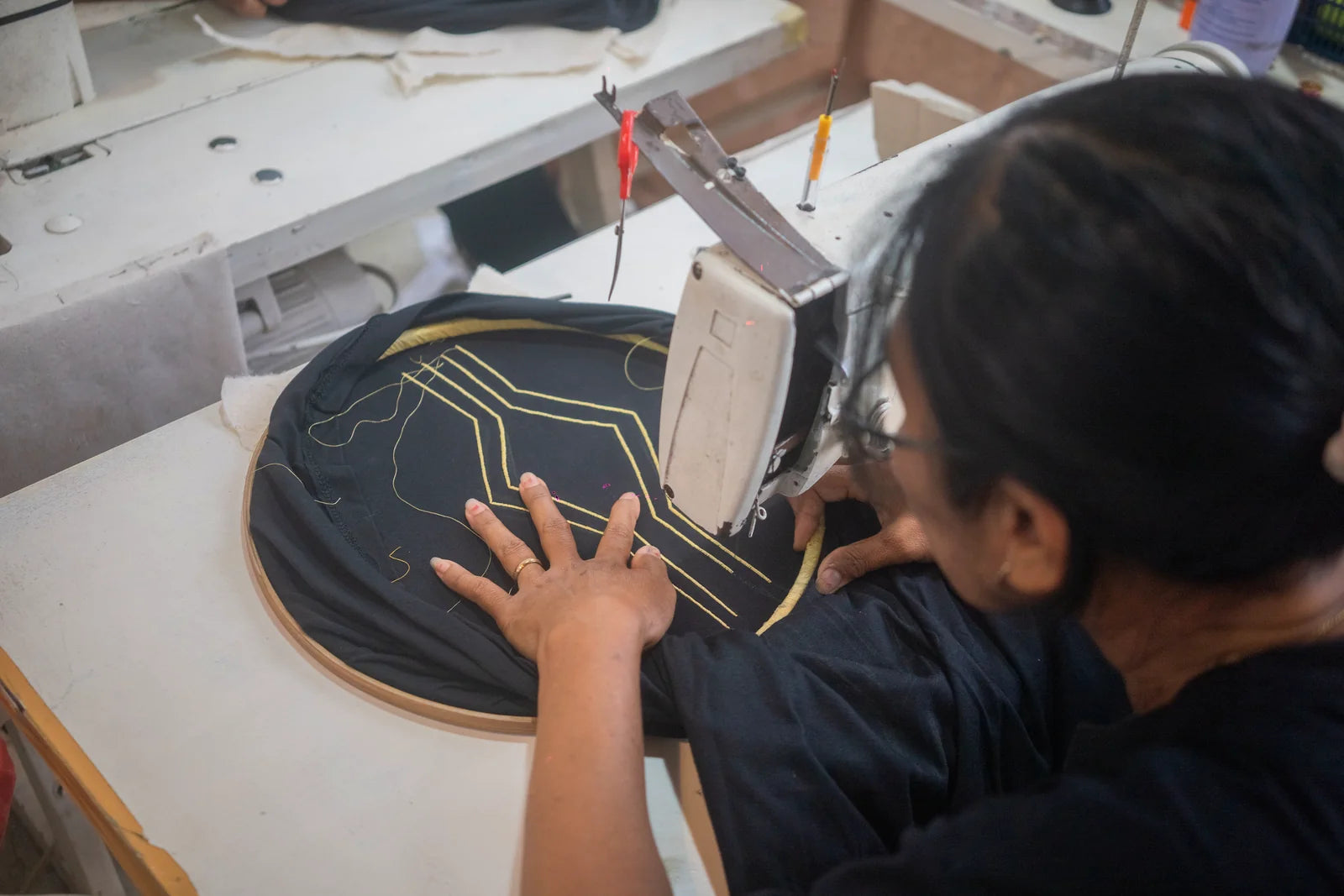 A close view of the embroidery machine translating a drawing