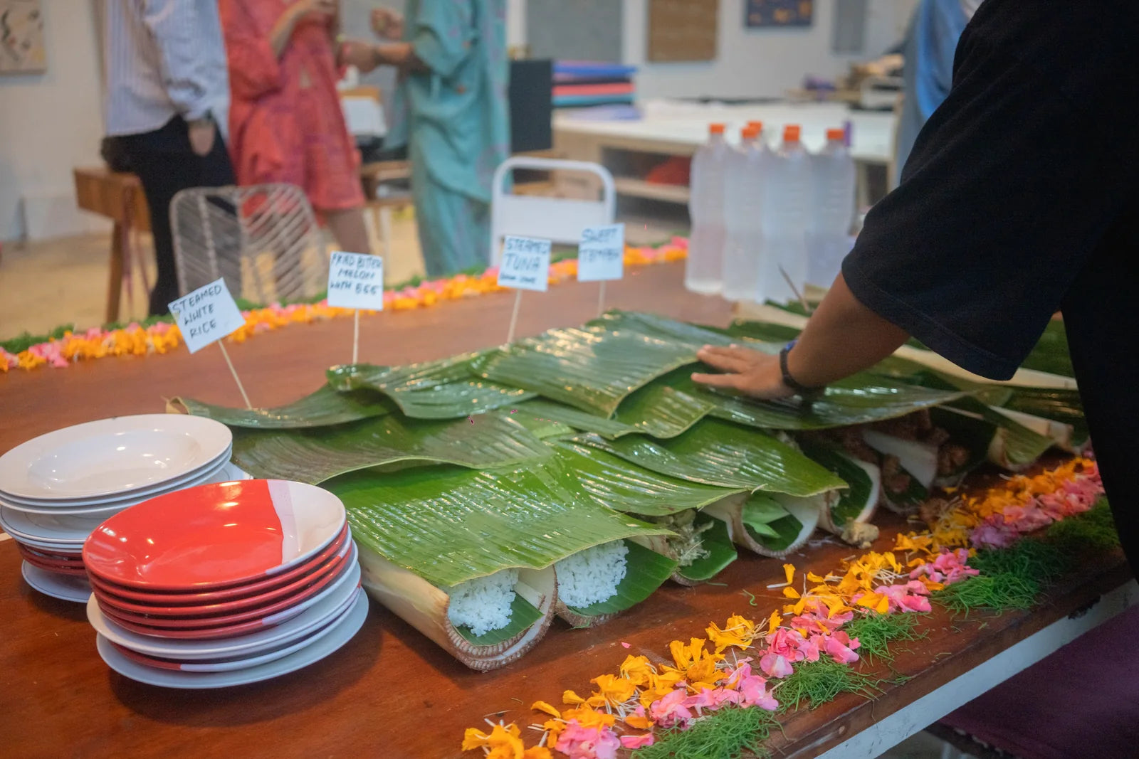 Banana leaves, plates and food prepared for the evening