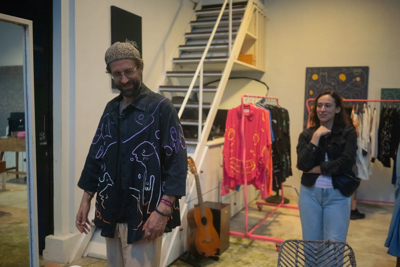 A guest wearing a finished black UKENA work in the studio