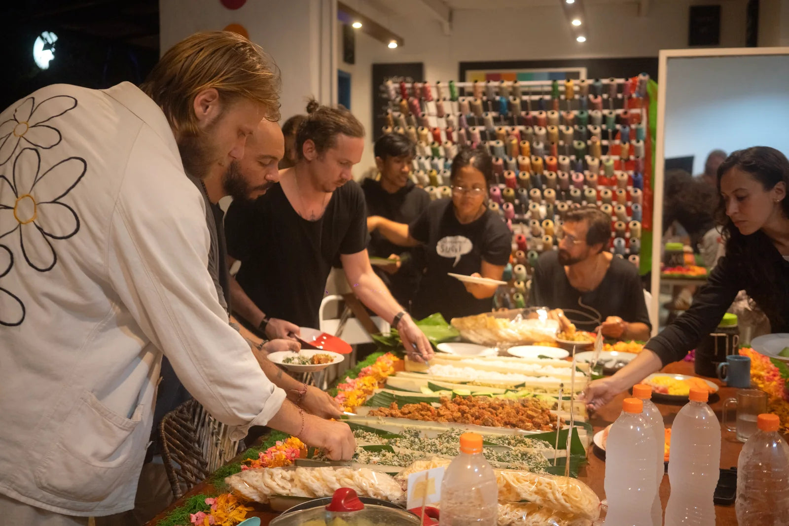 Friends serving food together around the table