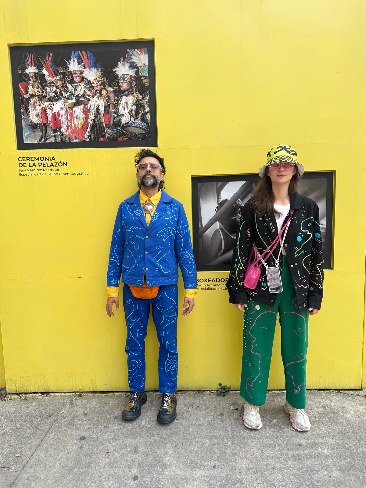 A second portrait of Varun and Morta against the yellow wall