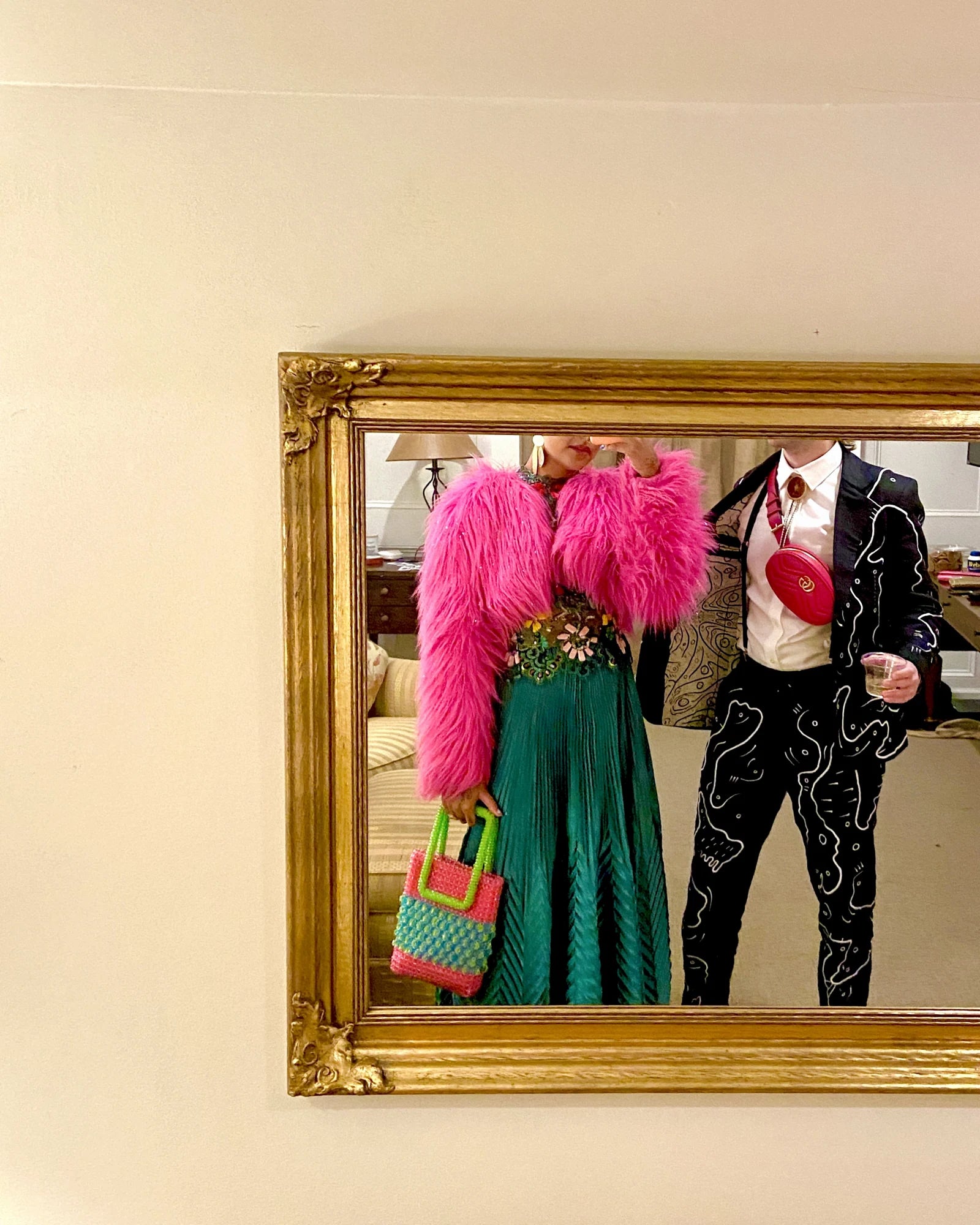 Forrest and Michelle reflected together in a gold framed mirror