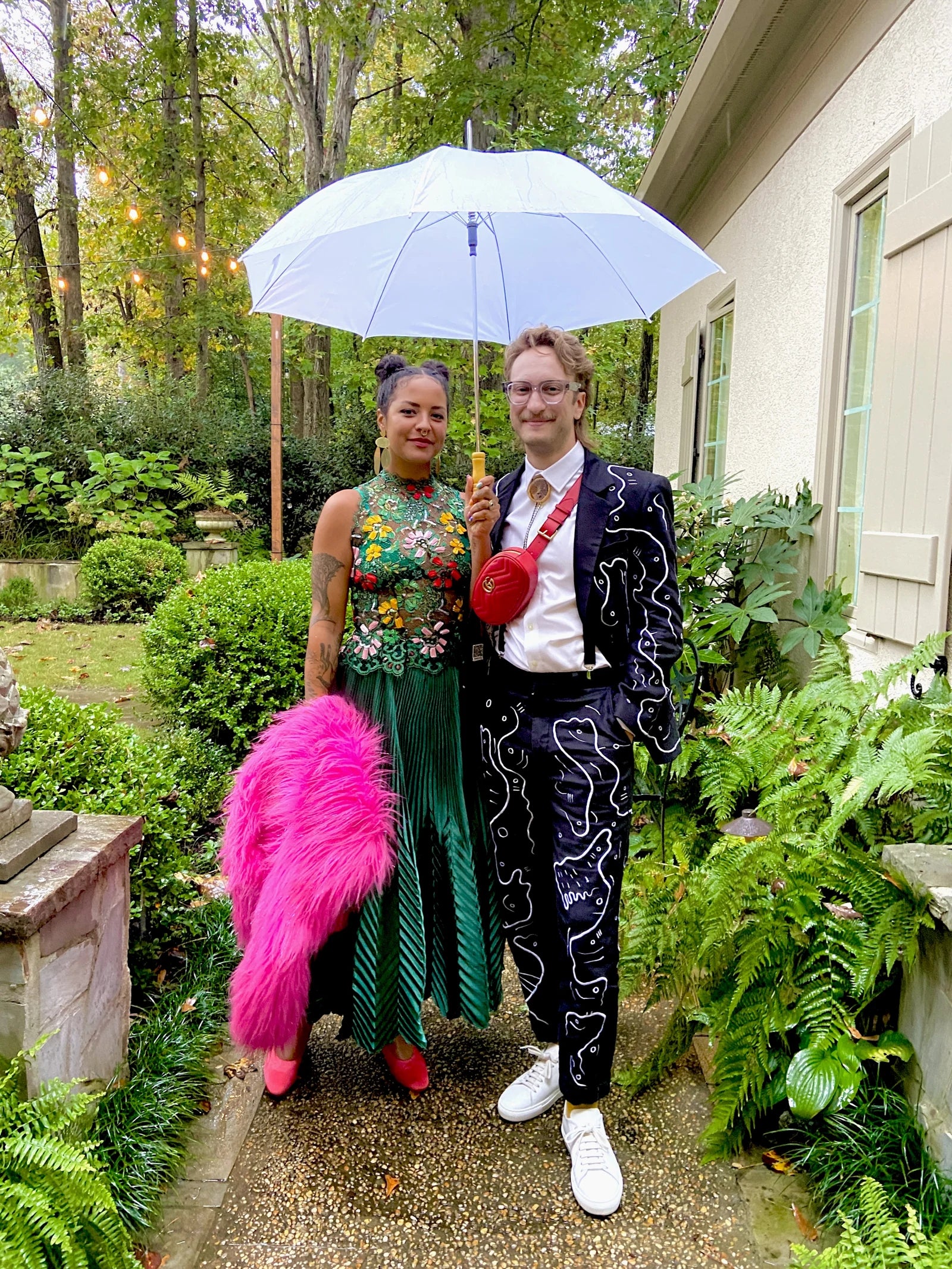 Forrest Aguar wearing his custom UKENA suit beside Michelle Norris