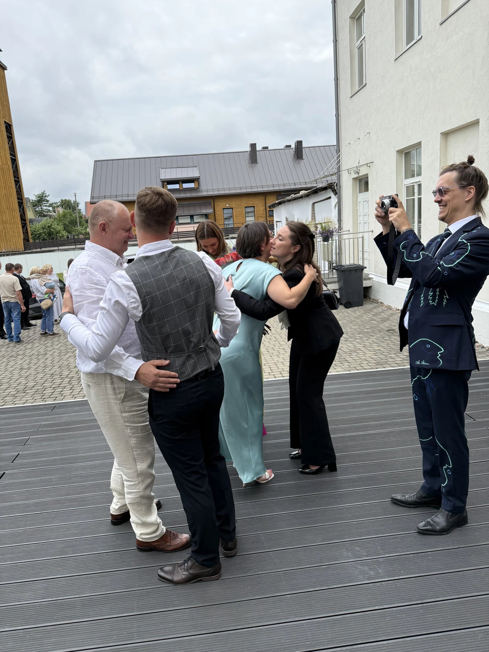 Ole joins guests during the wedding celebration in Lithuania