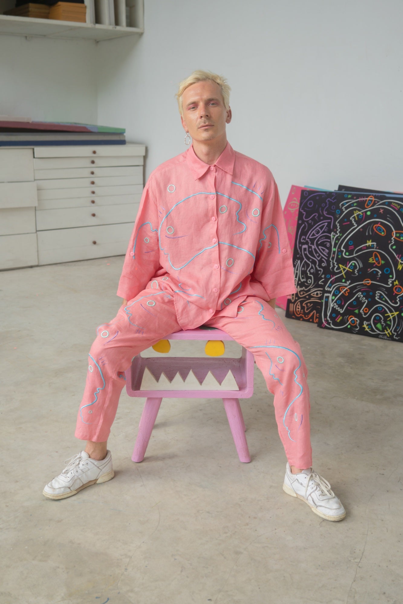 Ole wearing a pink Soft Code linen work in the studio